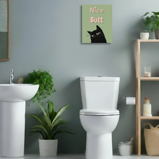 Bathroom with a toilet, sink, and decorative wall art.